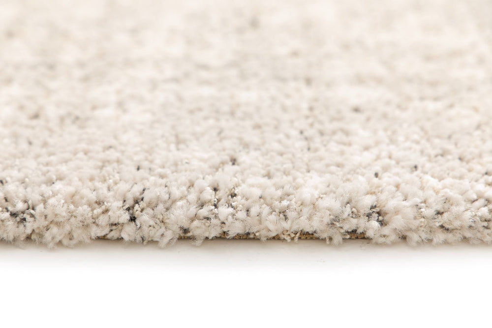 Side view of the rug showing plush thickness.