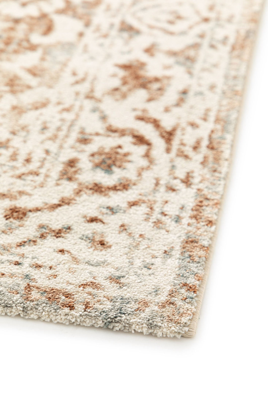 Edge view of a beige rug with rust floral design.
