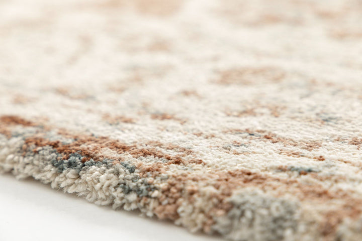 Side view showing the plush beige and rust rug texture.