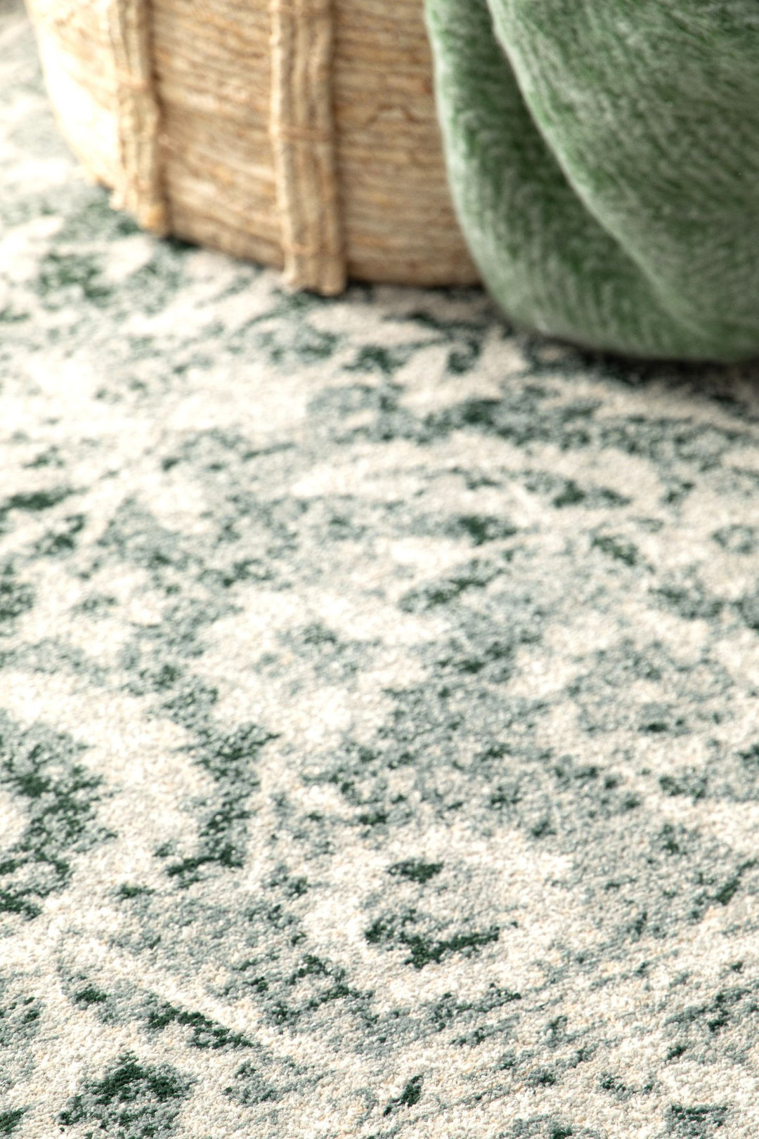 Decor accent showing a basket placed on a soft rug.