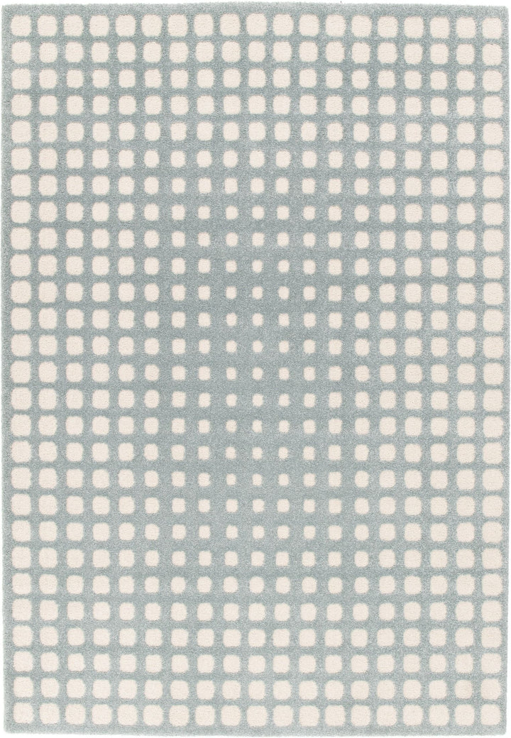 Full view of blue rug with white square design.