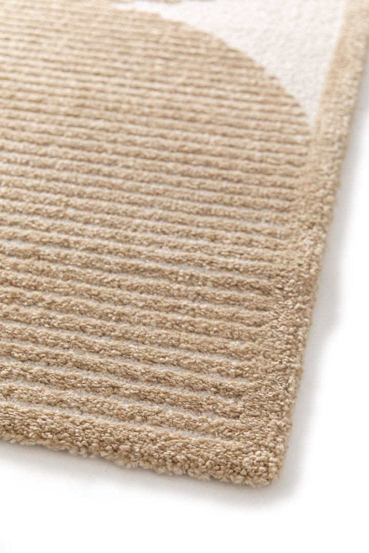 Close-up of textured beige rug.