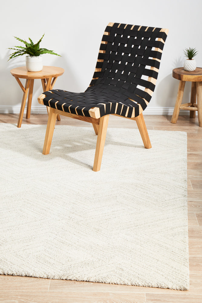 Alpine 844 Silver area rug styled in modern wooden furniture and hardwood flooring