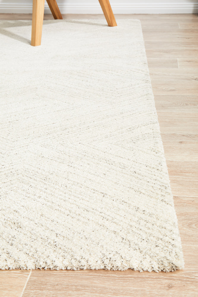 Alpine 844 Silver rug in minimalist space with silver and charcoal geometric design