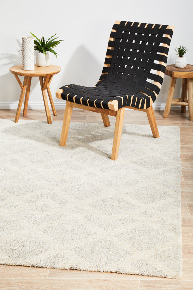 Alpine 855 Pebble rug in natural wood-themed space with grey and cream pebble tones