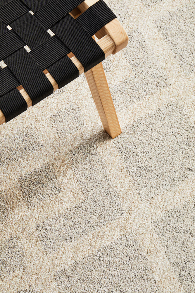 Alpine 855 Pebble area rug with natural stone-inspired grey tones in modern living room