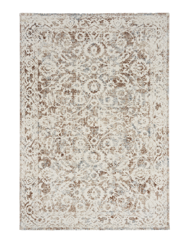 Close-up of a rug corner with beige and brown floral design.