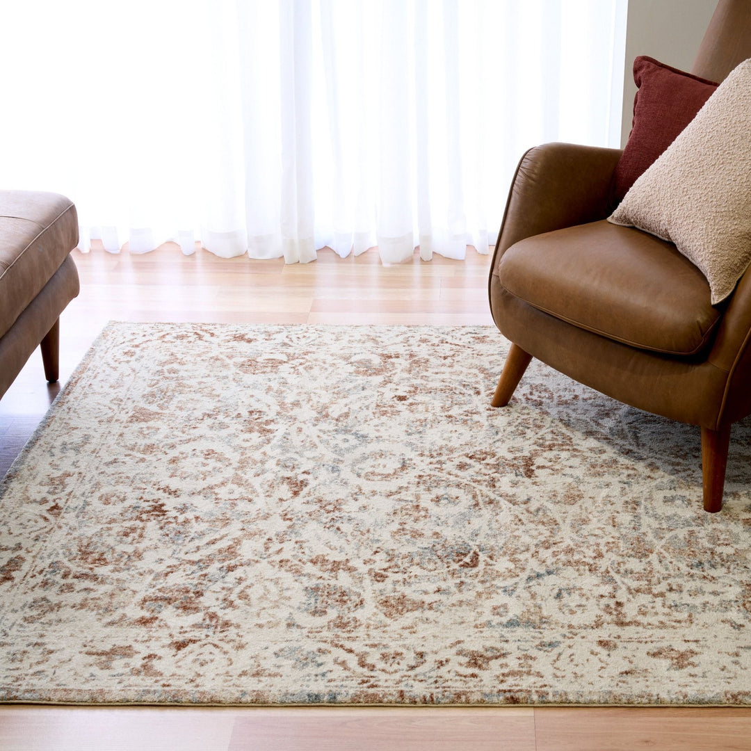 Side view showing thick pile of a beige and brown rug.