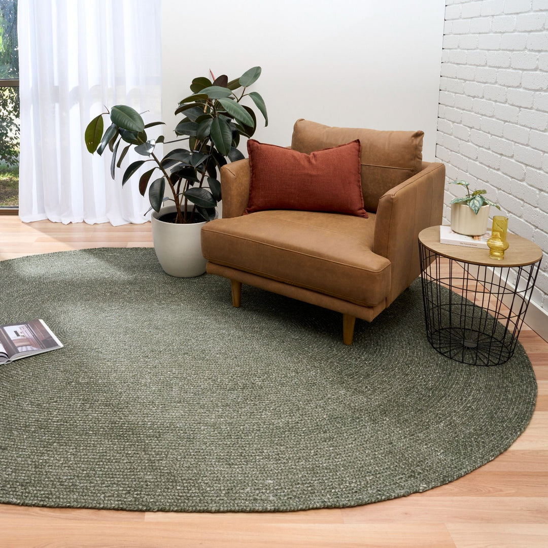 Green round wool rug