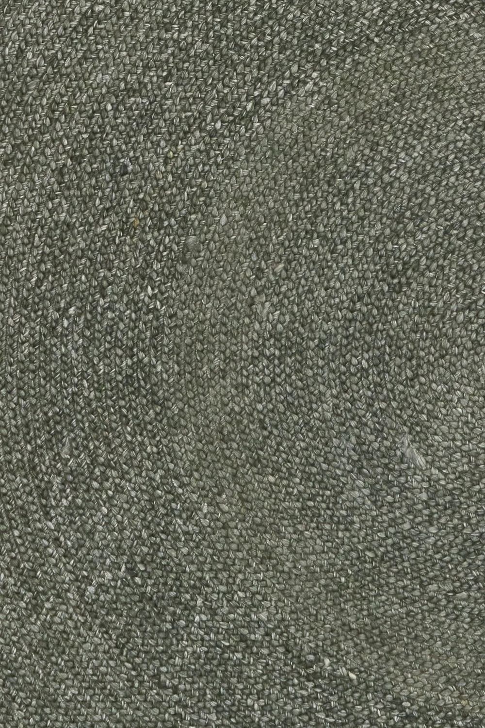 Close up of green round wool rug