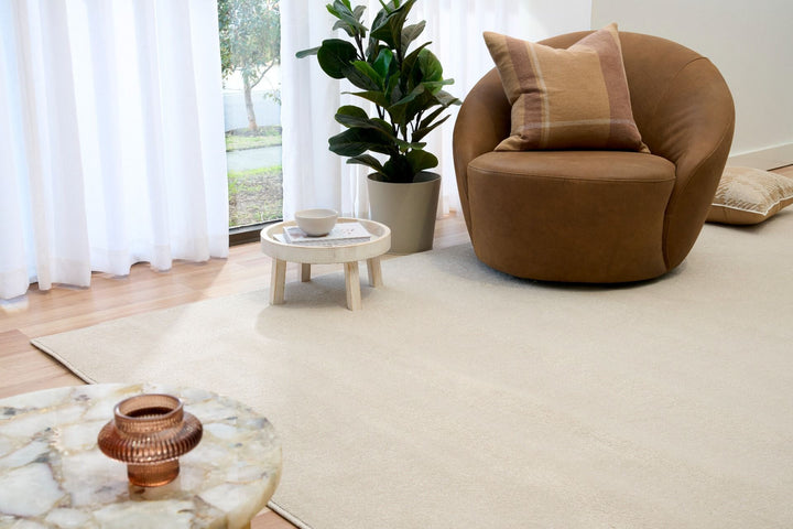 Cyrus ecru rug in modern living room scene.