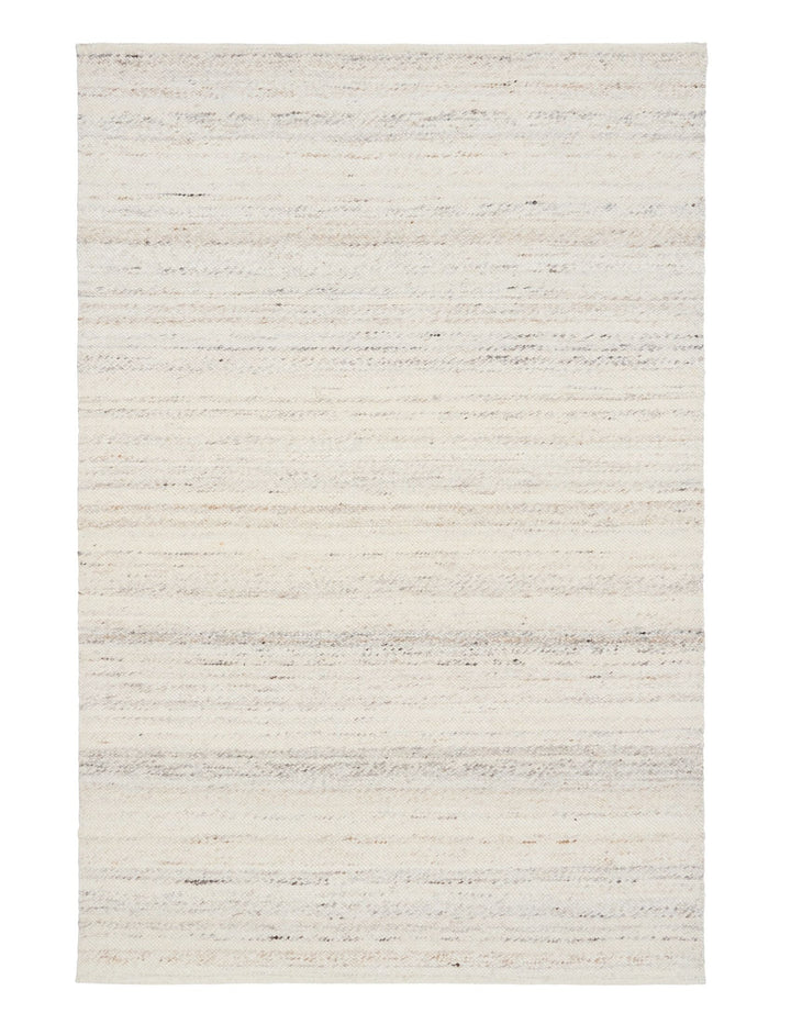 Full view of ivory handwoven rug with subtle grey and beige tones.