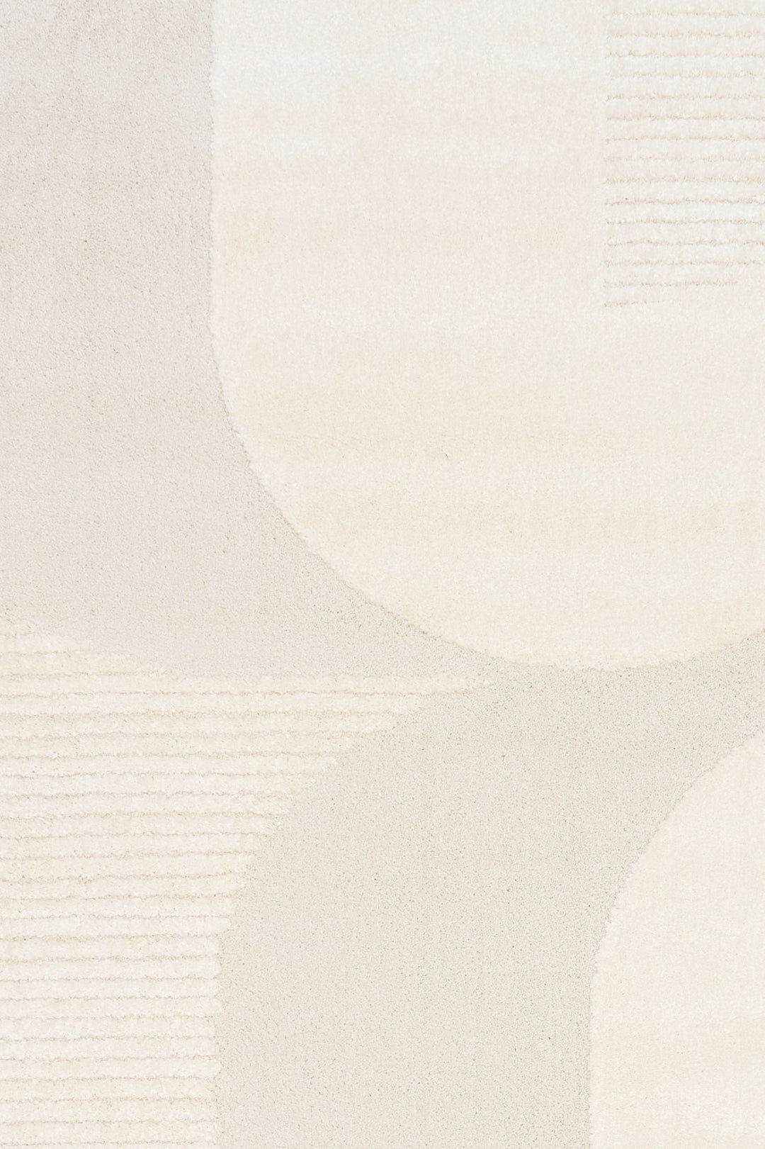 Close-up of cream rug showing curved abstract pattern.