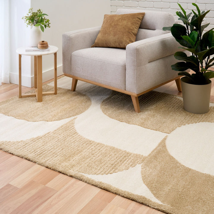 Beige rug in styled living room.