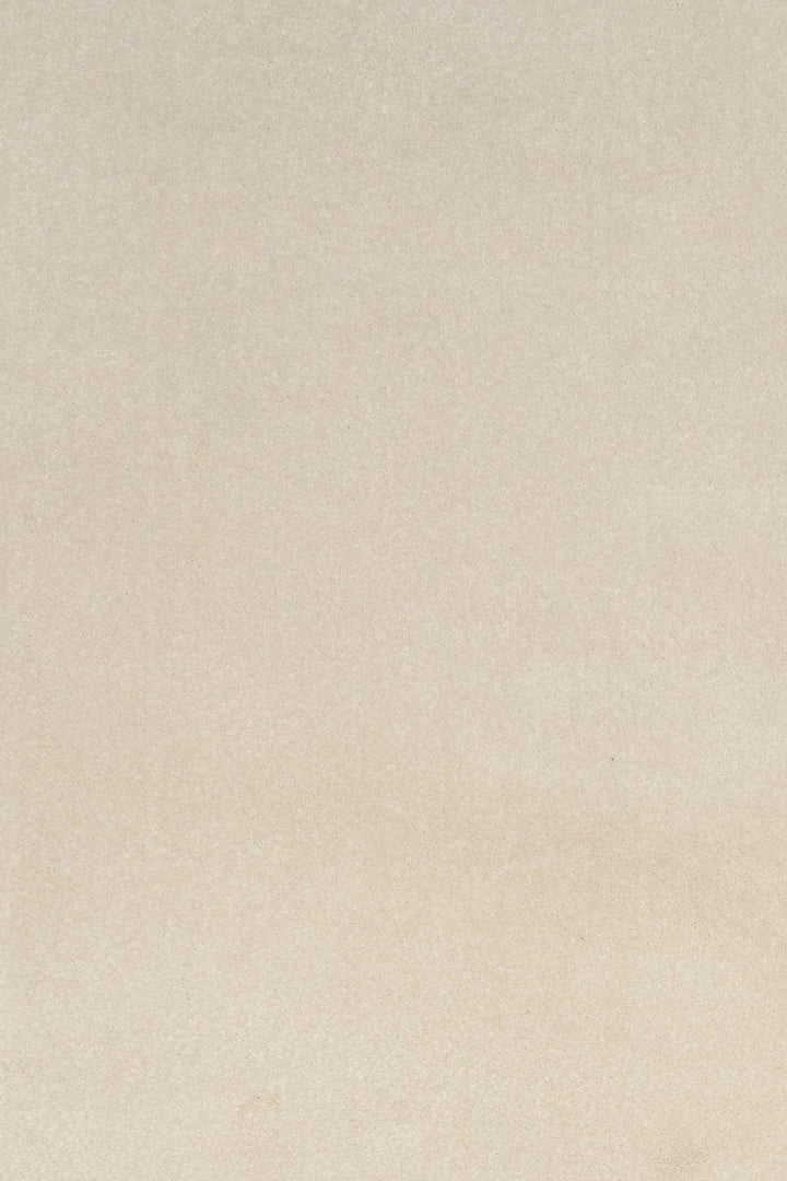 Close-up of plain beige rug texture.