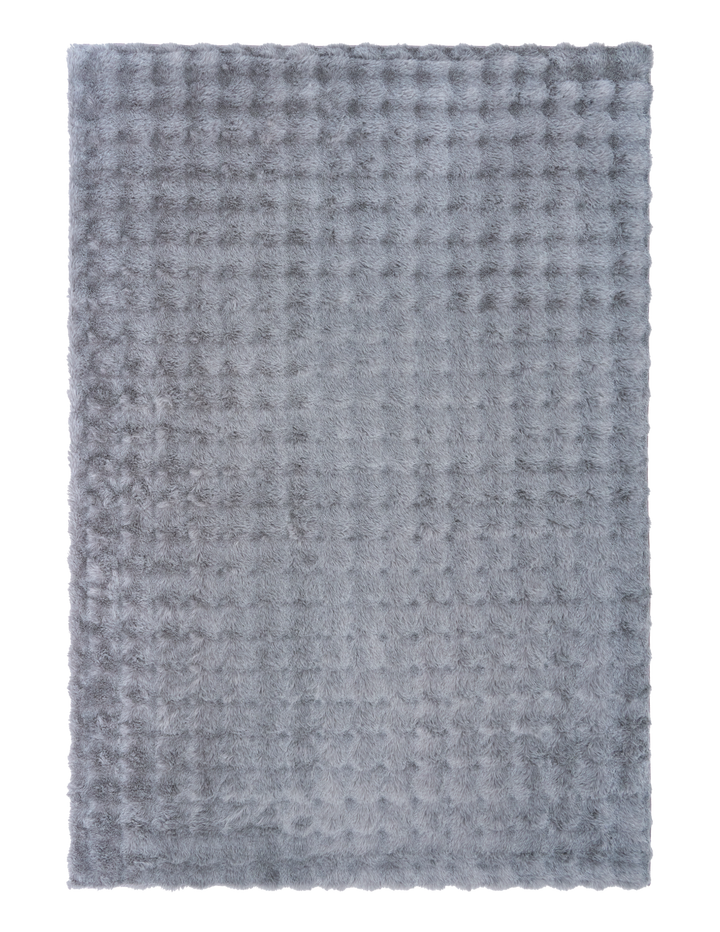 Full view of light grey textured fluffy rug on plain background.