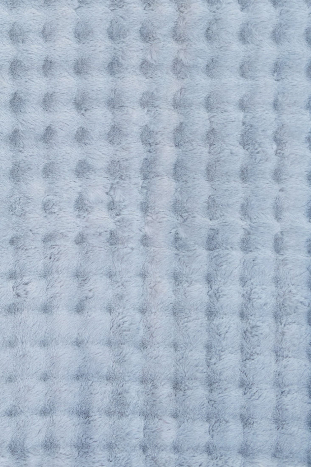 Light blue textured fluffy rug with soft raised pattern