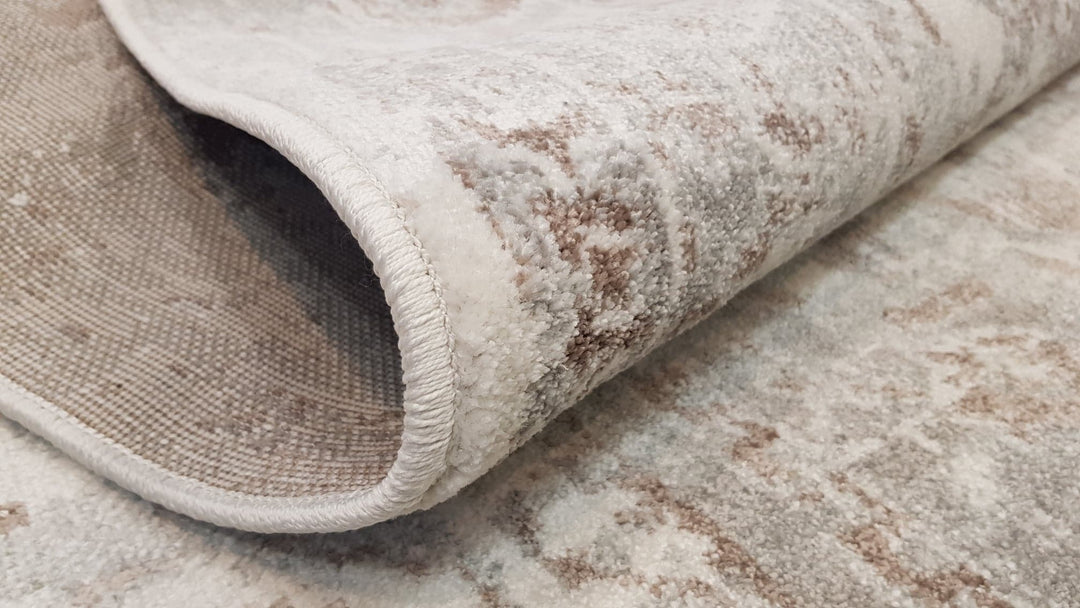 close up of transitional rug, neutral tones, vintage rug with fade design