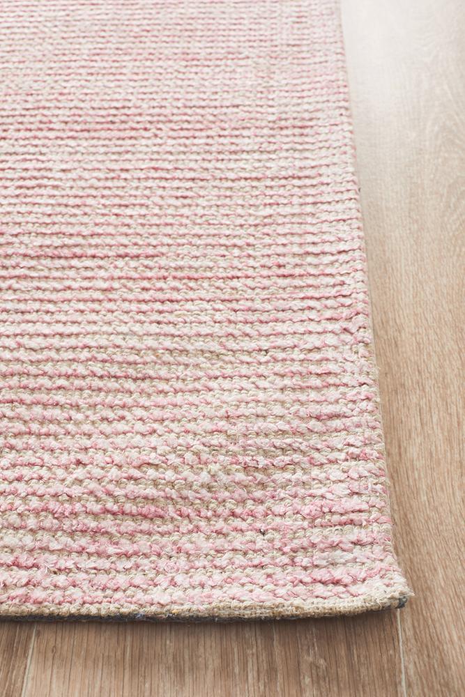 Allure Rose cotton rayon rug on hardwood floor showing natural loop fiber texture