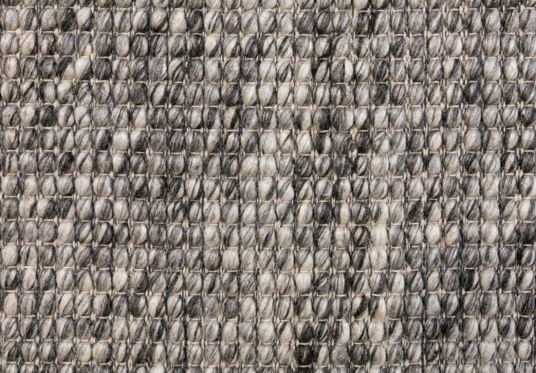 Detailed view of Dasha Dark Grey Wool Rug featuring black and white patterns