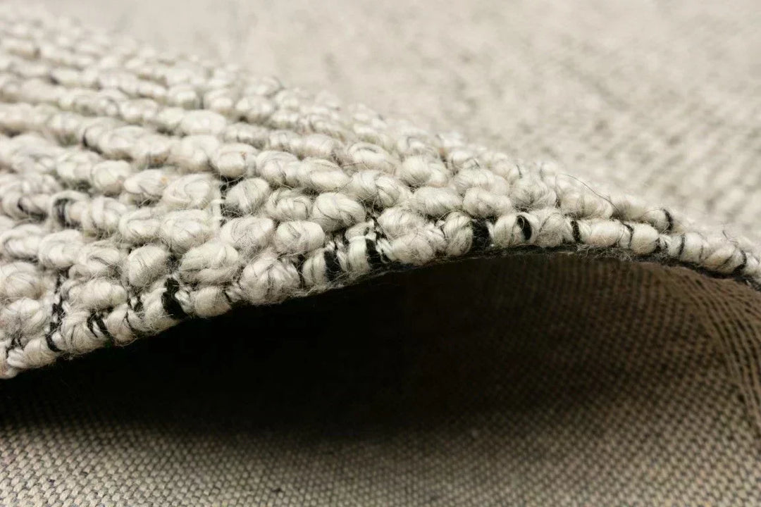Comparison of best rug materials for Australian homes showing wool, jute, polypropylene, PET textures