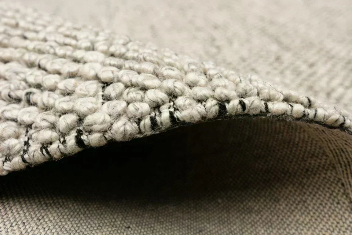 Comparison of best rug materials for Australian homes showing wool, jute, polypropylene, PET textures