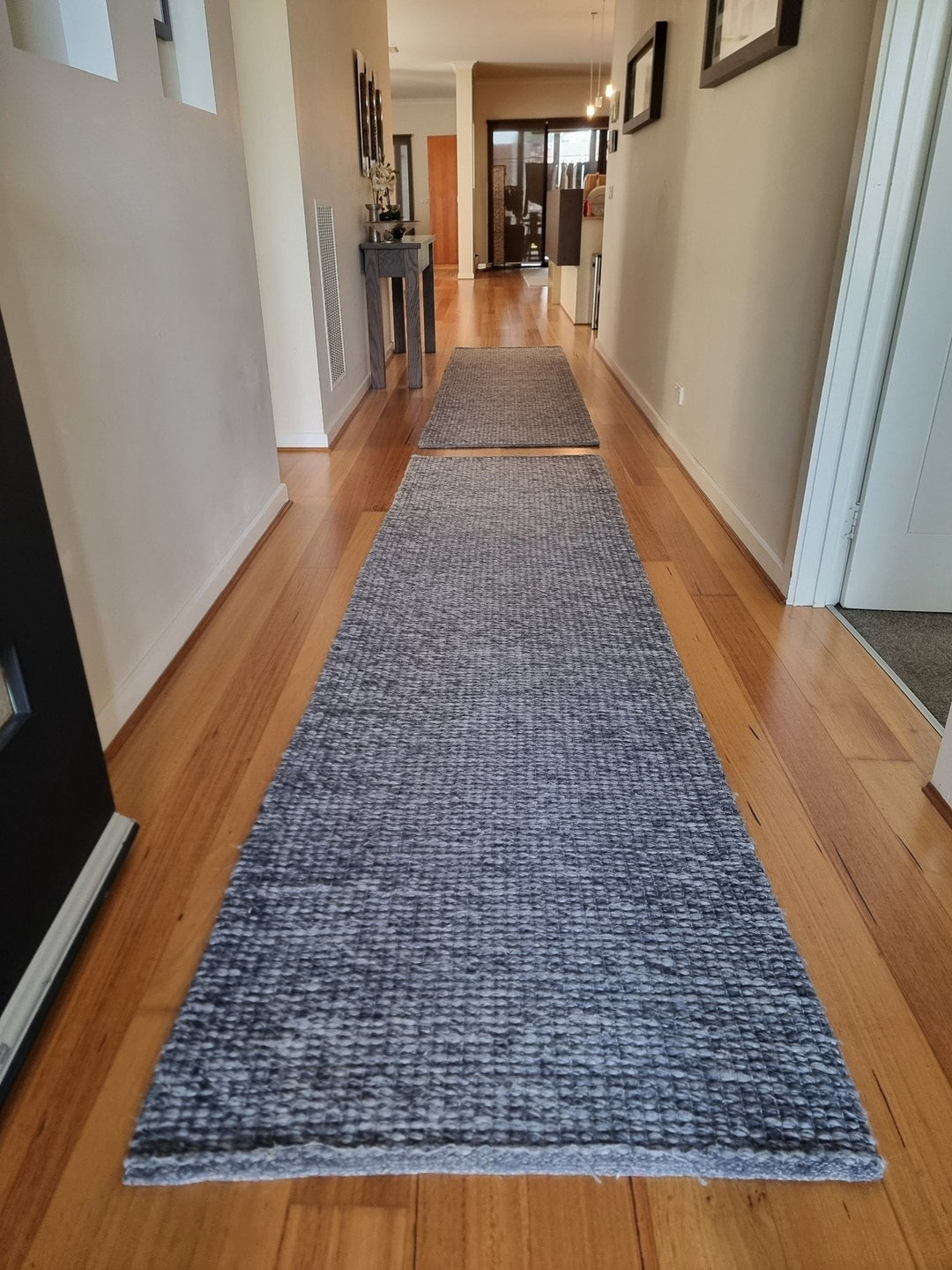 Two 80 cm hallway runner sections on timber flooring in a long corridor