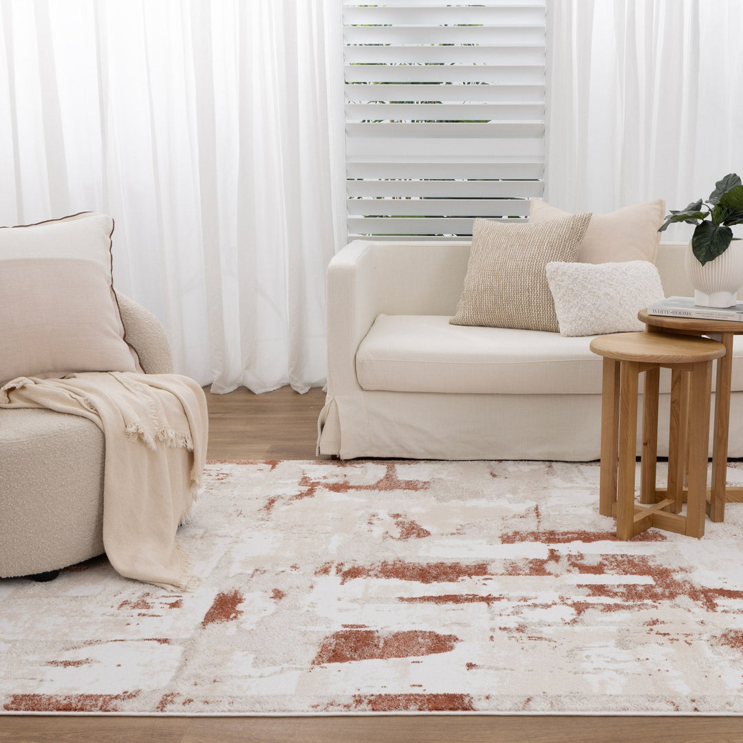 Modern boho-style rug in neutral tones styled in a contemporary Australian living room with natural light and timber flooring