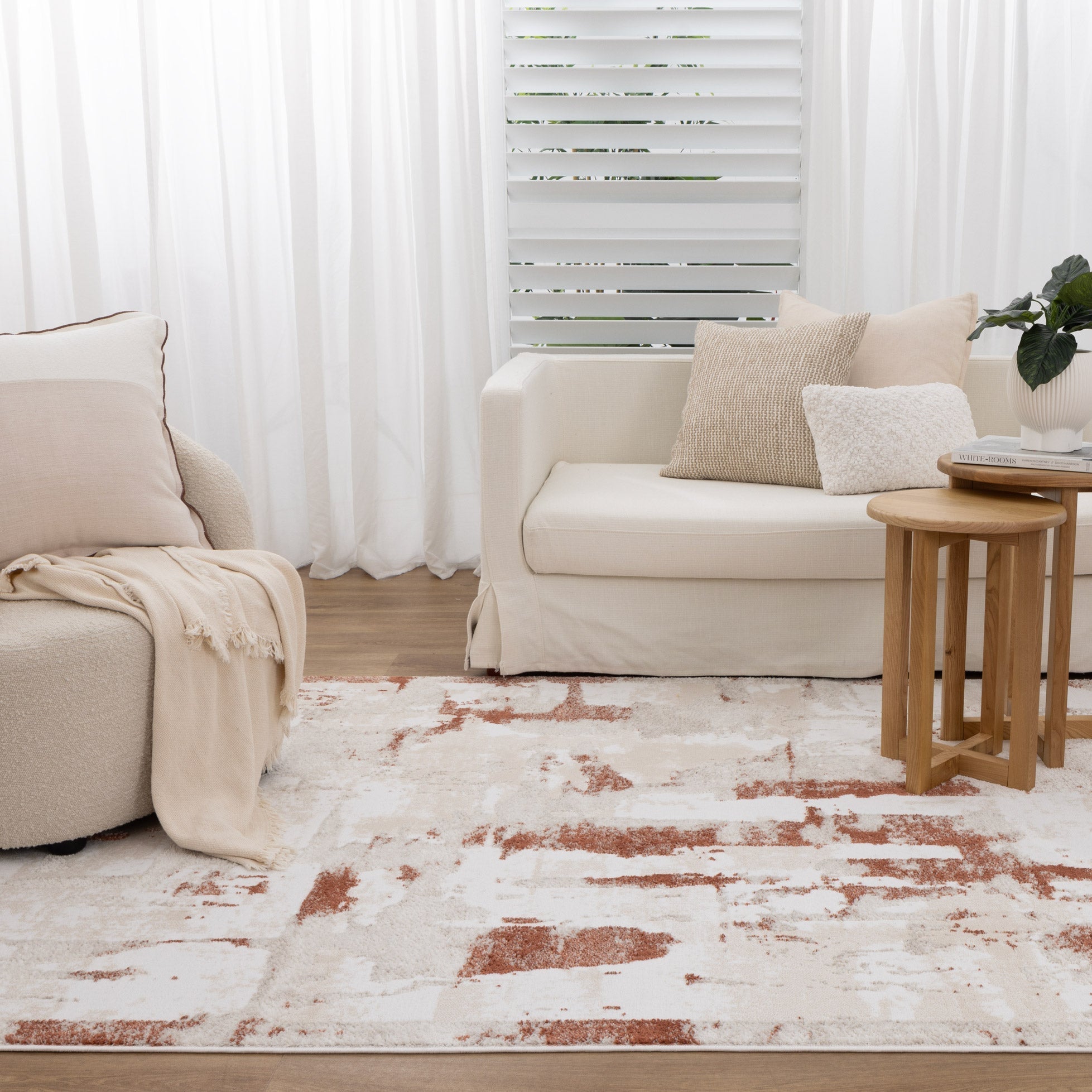 Modern boho-style rug in neutral tones styled in a contemporary Australian living room with natural light and timber flooring