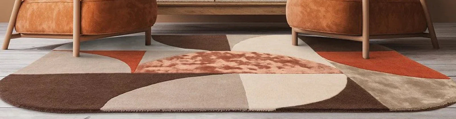 luxurious blend of wool and viscose in bold, hand-carved geometric patterns. Showcased in a modern living room with tan armchairs and terracotta accents, this contemporary rug