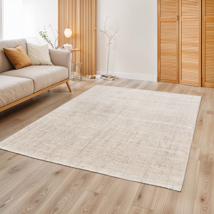 Beige rug placed in modern room.