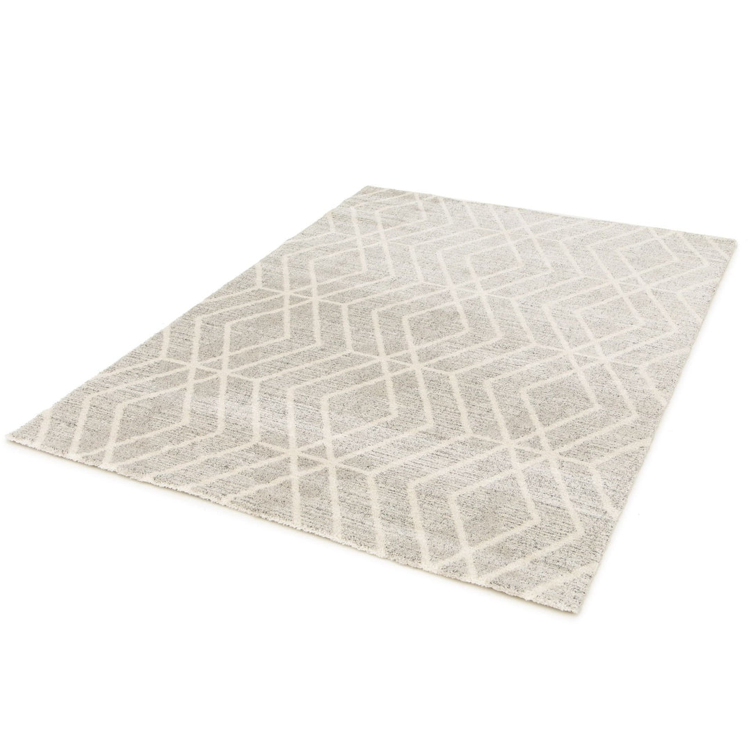Angled view of a large grey patterned rug.
