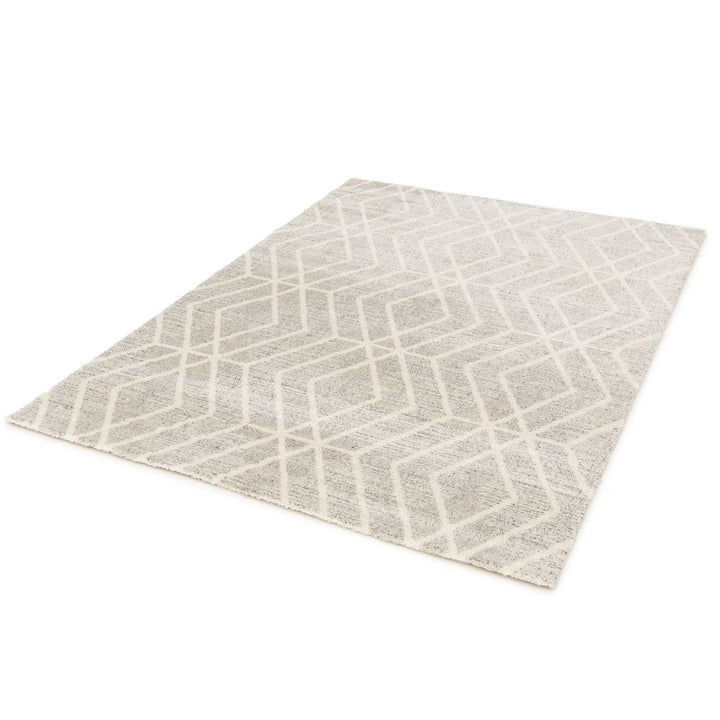 Angled view of a large grey patterned rug.