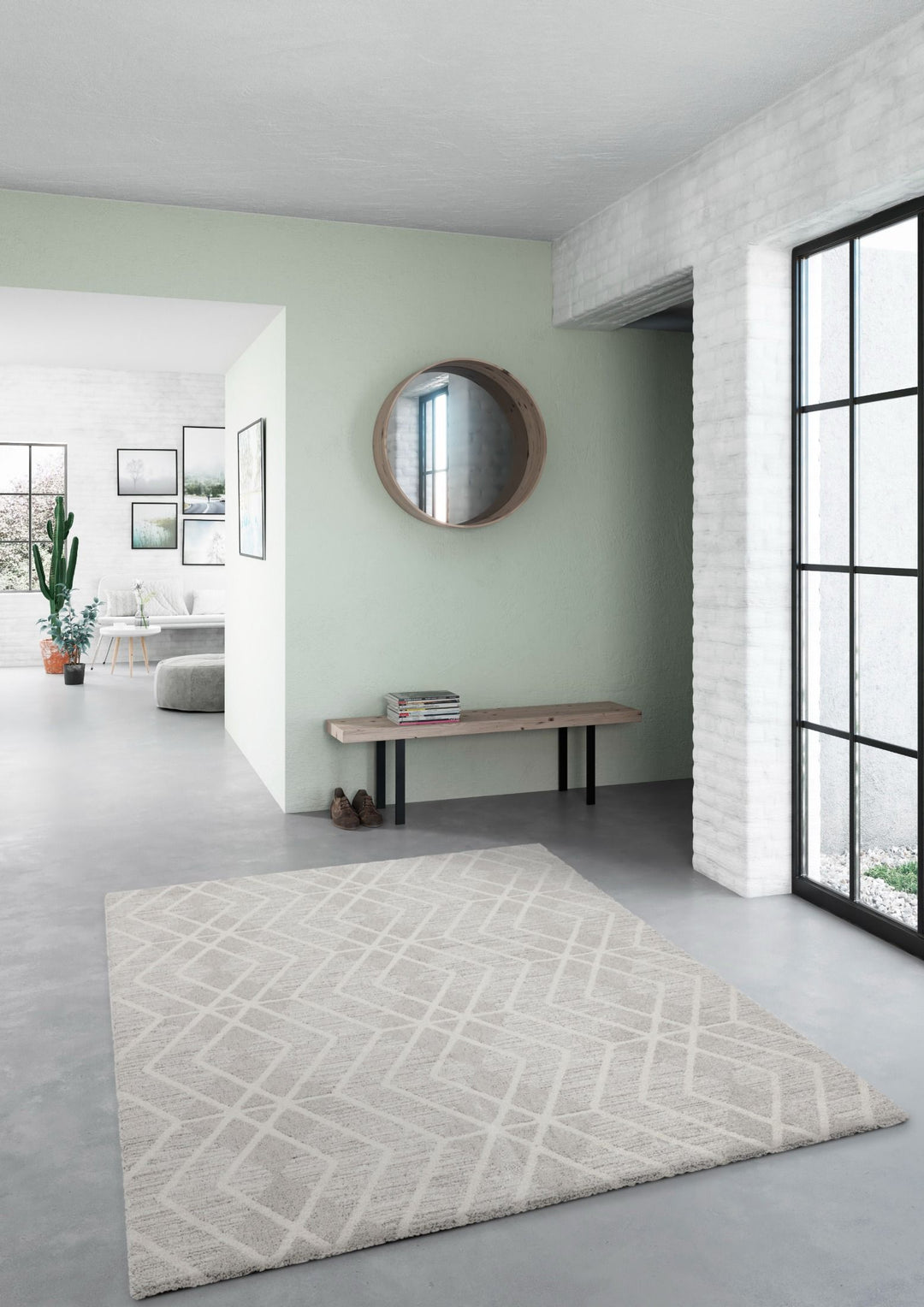 Grey geometric rug placed in a modern entryway.