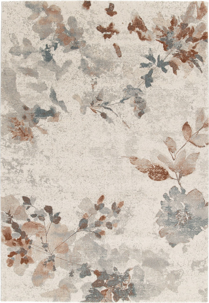 A full view of a floral patterned rug in beige, blue, and rust tones.
