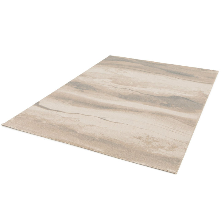 Beige and brown patterned rug angled view.