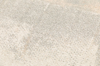Close-up texture of soft grey rug fibers.
