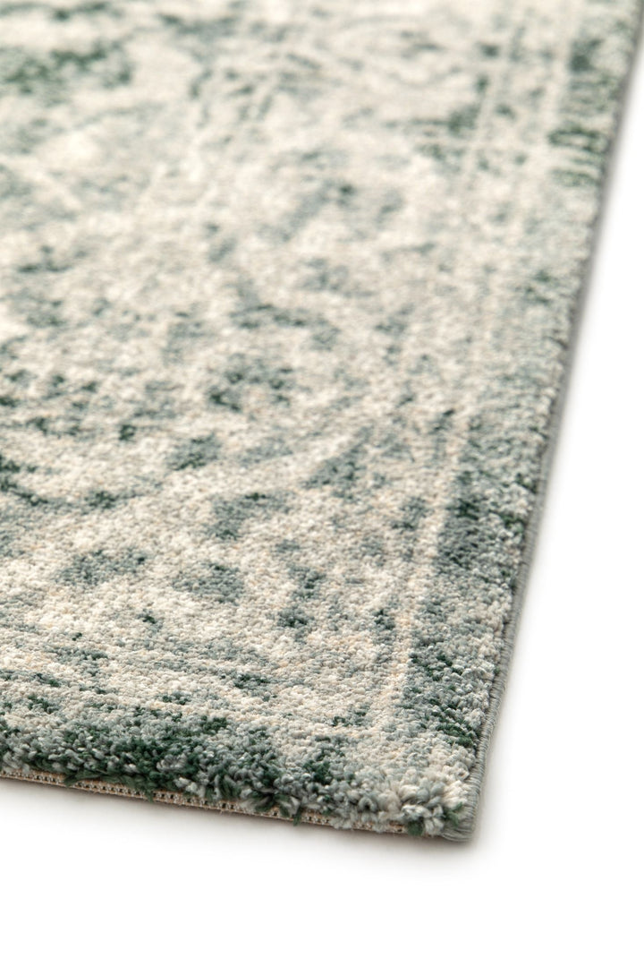 Detailed corner view of a soft patterned rug.