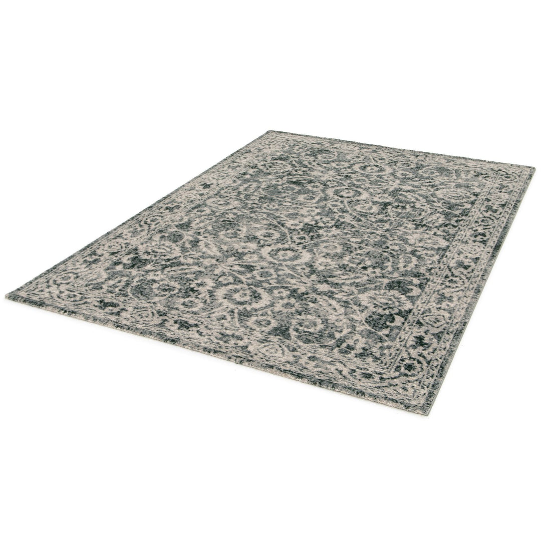 Modern rug in beige, grey, and rust tones on display.