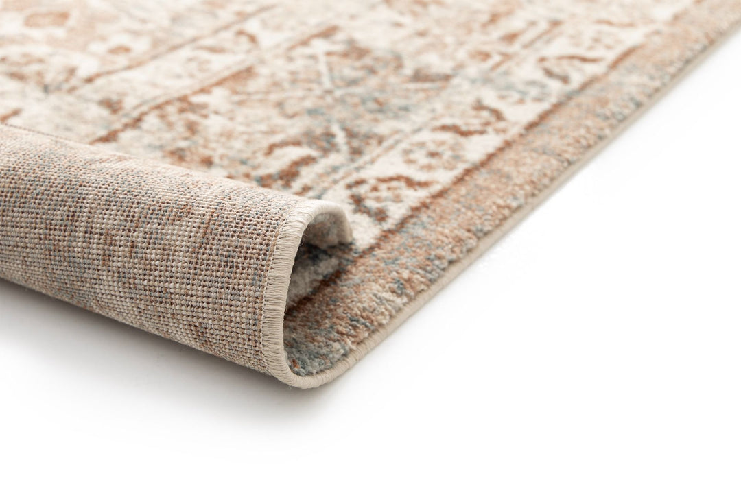 Rolled rug corner showing textured weave