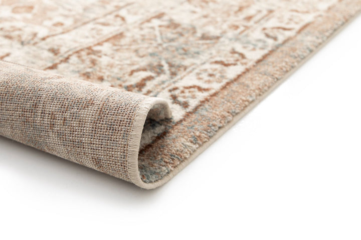 Rolled rug corner showing textured weave