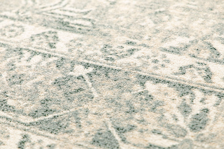 Textured close-up of rug fibers and design.