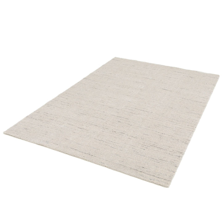 Full beige rug angled view.