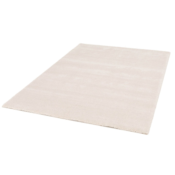 Angled perspective of the beige rug laid flat.