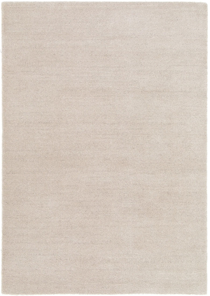 Full top view of a plain light beige rug.