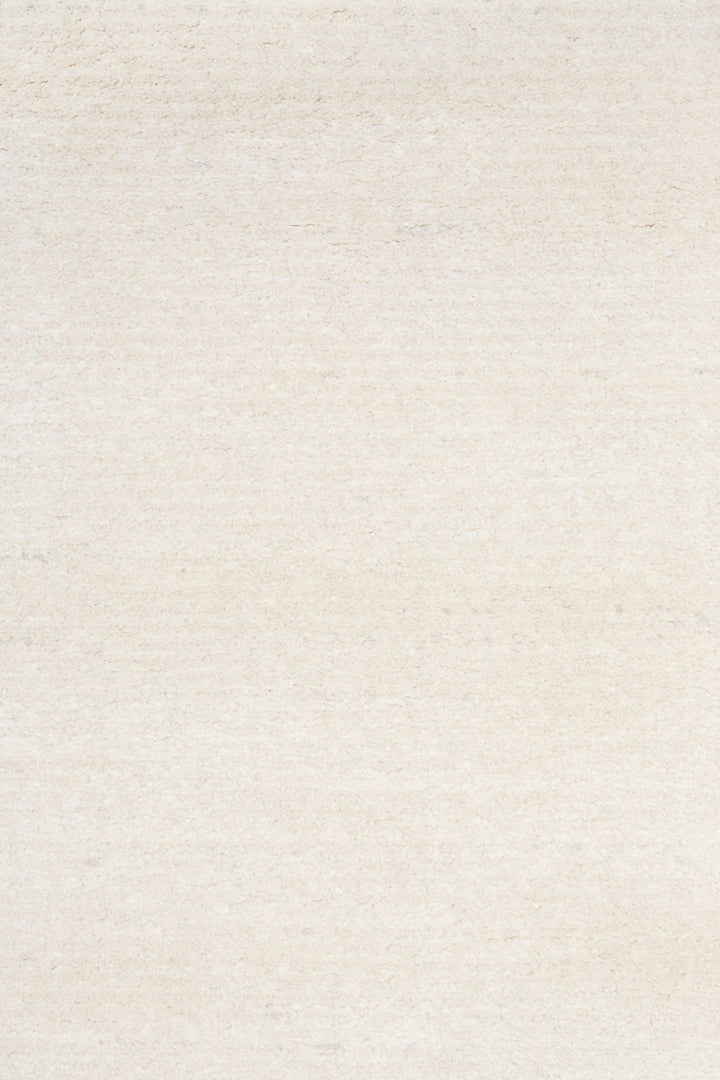 Close-up of beige textured rug fabric.