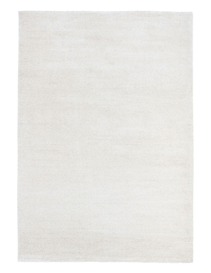Full top view of a slightly brighter beige rug against a white backdrop.