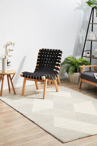 Alpine 833 Stone area rug placed in living room  with natural wooden neutral decor styling