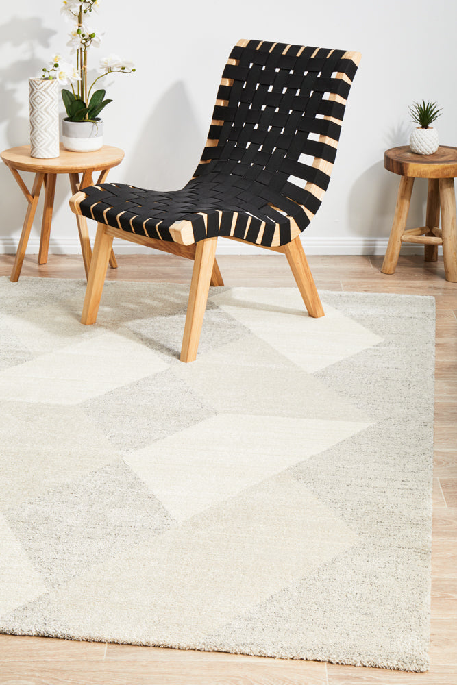 Alpine 833 Stone area rug styled in a room with natural wood and earth tones