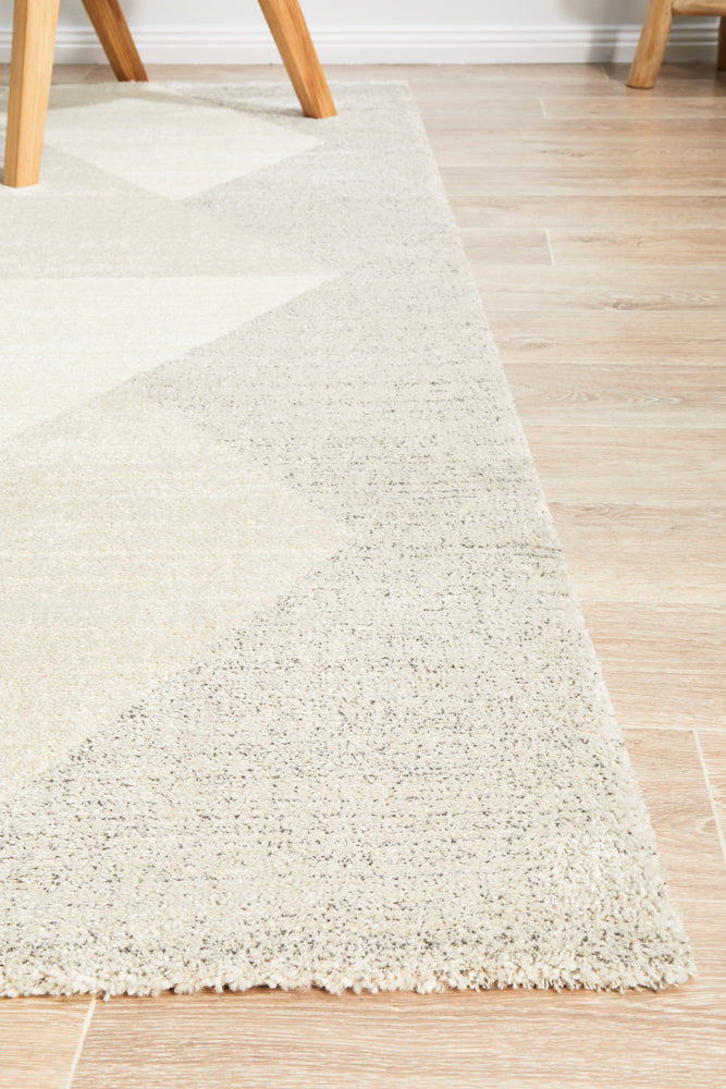 Alpine 833 Stone rug on hardwood floor showing plush thick pile texture and geometric pattern